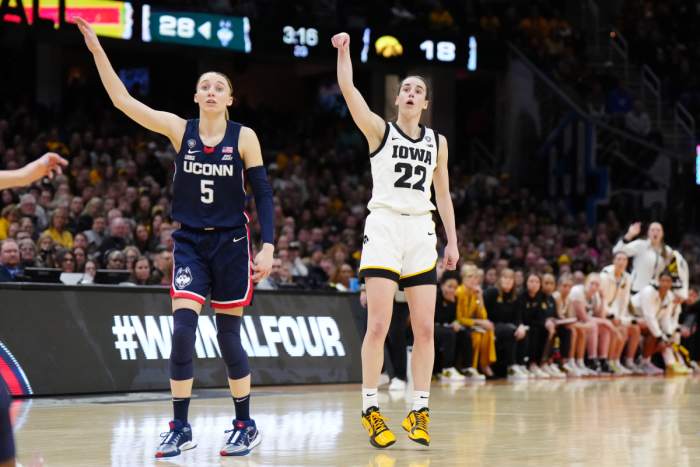 Iowa Hawkeyes guard Caitlin Clark (22) and Connecticut Huskies guard Paige Bueckers (5) react in the second quarter in the semifinals of the Final Four of the womens 2024 NCAA Tournament at Rocket Mortgage FieldHouse.