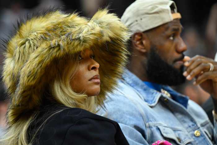 May 13, 2024; Cleveland, Ohio, USA; Los Angeles Lakers forward LeBron James and his wife Savannah James watch the game in the second quarter of game four of the second round for the 2024 NBA playoffs between the Cleveland Cavaliers and the Boston Celtics at Rocket Mortgage FieldHouse. Mandatory Credit: David Richard-USA TODAY Sports