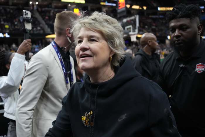 Former Iowa Hawkeyes head coach Lisa Bluder reacts after practice at Rocket Mortgage FieldHouse.