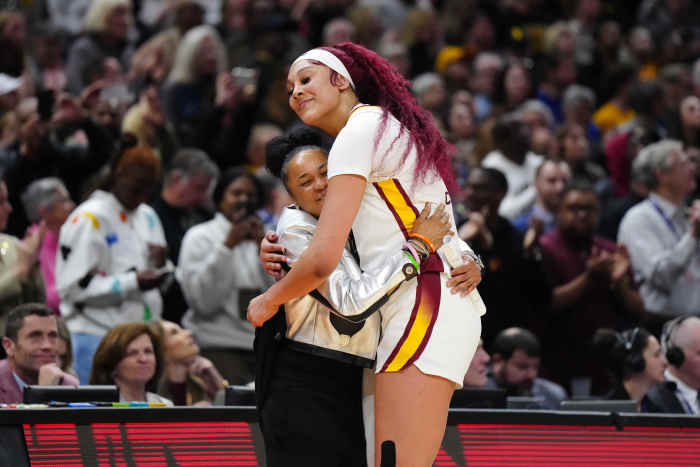 Apr 7, 2024; Cleveland, OH, USA; South Carolina Gamecocks head coach Dawn Staley and center Kamilla Cardoso (10) embrace during the 2024 NCAA Tournament Women's Final Four championship game against the Iowa Hawkeyes at Rocket Mortgage FieldHouse.