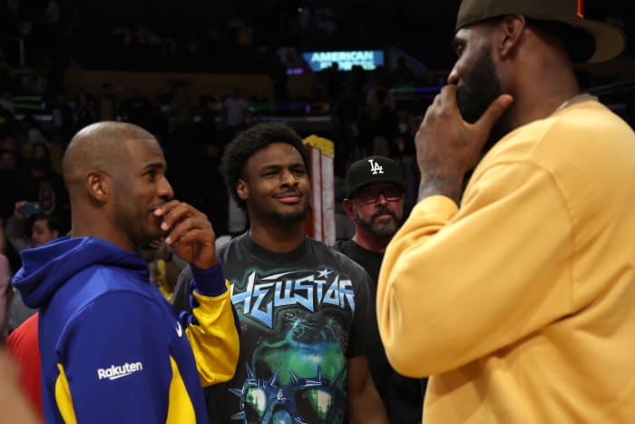 NBA guard Chris Paul (3), Los Angeles Lakers forward LeBron James (23) and guard Bronny James