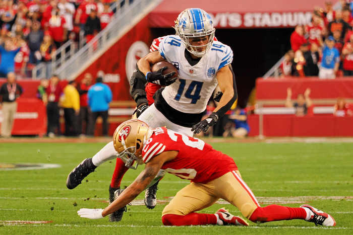 Jan 28, 2024;  Santa Clara, California, USA;  San Francisco 49ers cornerback Ambry Thomas (20) upends Detroit Lions wide receiver Amon-Ra St. Brown (14) during the first half of the NFC Championship football game at Levi's Stadium.