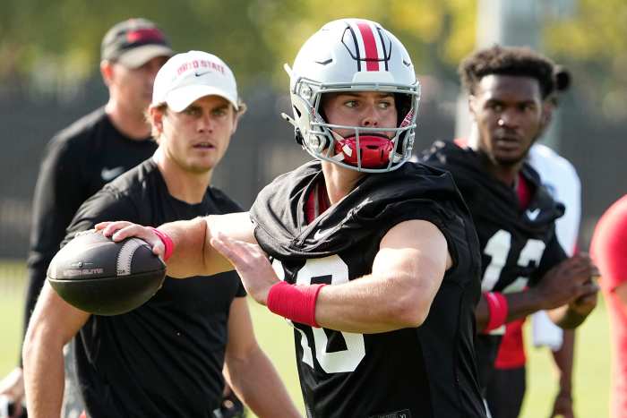 Ohio State Buckeyes quarterback Will Howard (18) throws during football camp at Woody Hayes Athletic Complex.