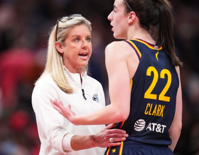 Indiana Fever head coach Christie Sides talks to Indiana Fever guard Caitlin Clark (22) during a timeout Tuesday, May 28, 2024, during the game at Gainbridge Fieldhouse in Indianapolis.