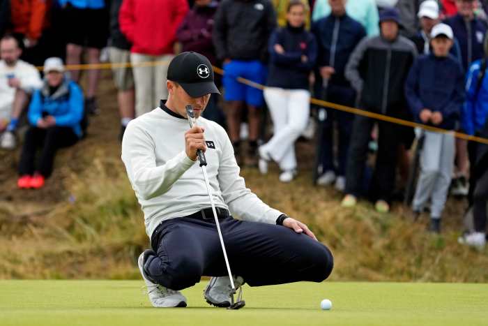 Jordan Spieth lines up his putt on the 12th green during the final round of the Open Championship golf tournament at Royal Troon.