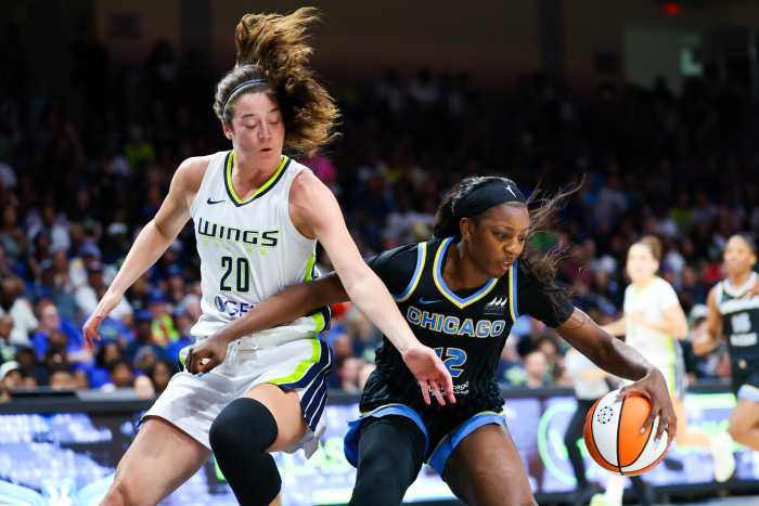Chicago Sky forward Michaela Onyenwere (12) dribbles as Dallas Wings forward Maddy Siegrist (20) defends during the second half at College Park Center.