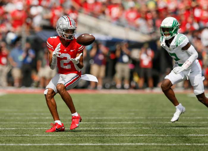 Ohio State Buckeyes wide receiver Chris Olave (2) catches a pass in front of Oregon Ducks cornerback Mykael Wright (2) during the second half of their NCAA football game at Ohio Stadium in Columbus on Saturday, Sept. 11, 2021.