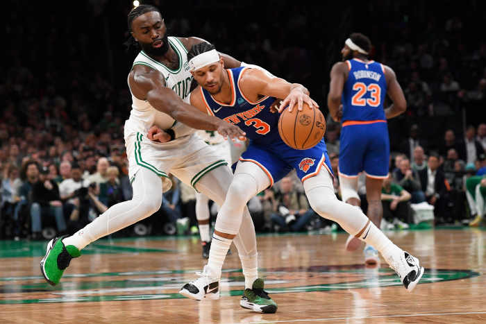 Boston Celtics guard Jaylen Brown (7) tries to steal the ball from New York Knicks guard Josh Hart (3) during the second half at TD Garden