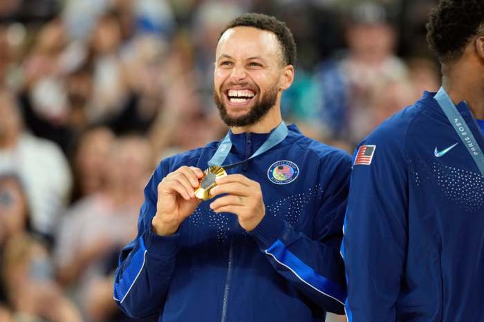 Team USA's Stephen Curry celebrates with the gold medal at the 2024 Paris Olympics on August 10, 2024.