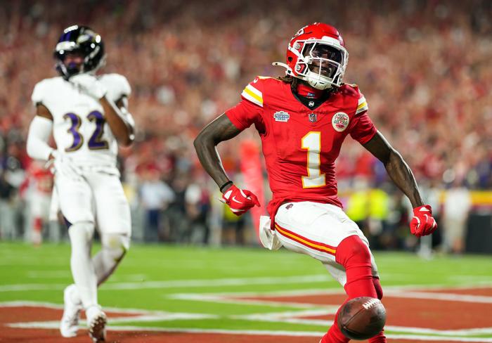 Kansas City Chiefs wide receiver Xavier Worthy (1) scores a touchdown against Baltimore Ravens safety Marcus Williams (32) during the first half.