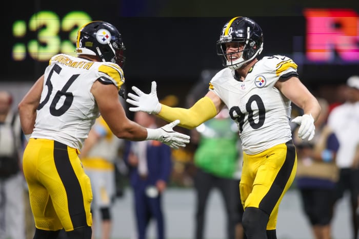 Steelers linebacker T.J. Watt (90) celebrates with linebacker Alex Highsmith (56) after a sack against the Atlanta Falcons.