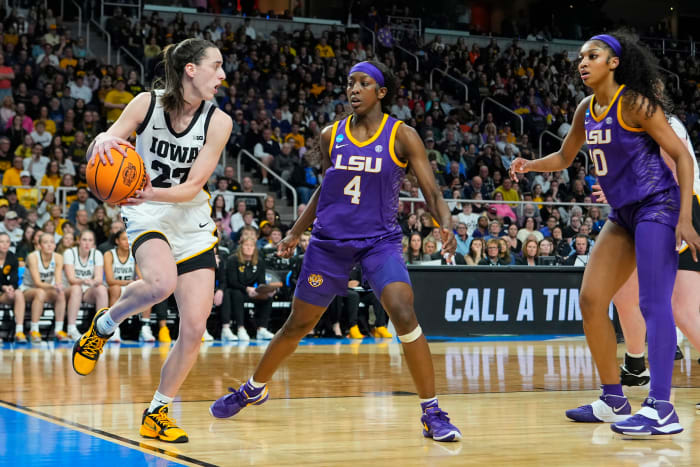 Iowa Hawkeyes guard Caitlin Clark (22), LSU Tigers guard Flau'jae Johnson (4) and LSU Tigers forward Angel Reese (10).