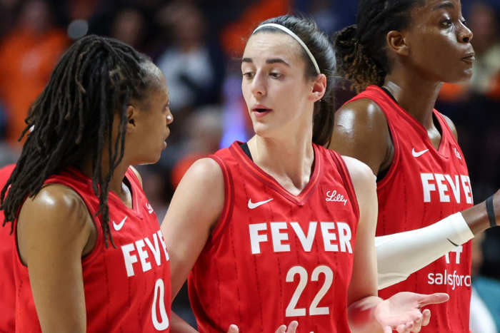 Indiana Fever guard Caitlin Clark (22) talks to Indiana Fever guard Kelsey Mitchell (0) during the 2024 WNBA Playoffs.
