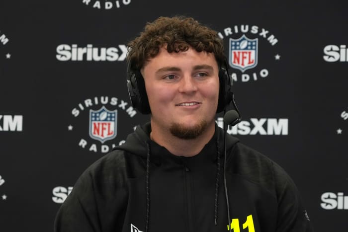 Feb 26, 2025; Indianapolis, IN, USA; Michigan defensive lineman Mason Graham (DL11) on the SiriusXM radio set during the 2025 NFL Scouting Combine at the Indiana Convention Center.