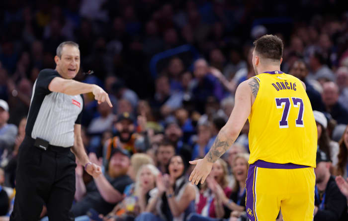 Lakers guard Luka Doncic and NBA referee.