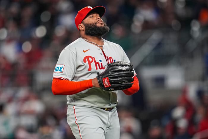 Philadelphia Phillies pitcher Jose Alvarado (46) reacts after retiring the side against the Atlanta Braves during the eighth inning at Truist Park.