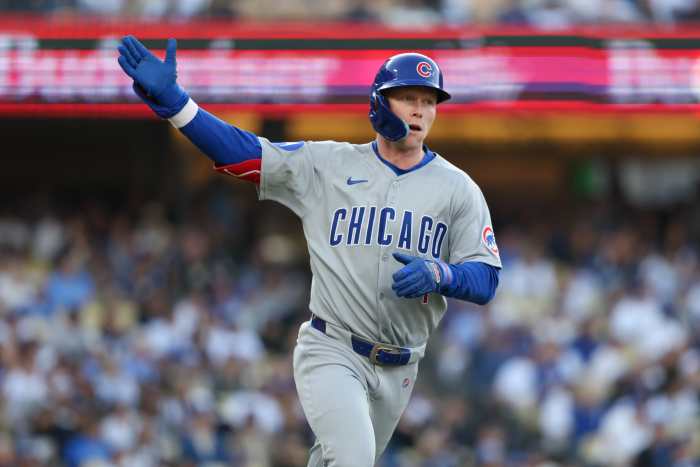 Chicago Cubs outfielder Pete Crow-Armstrong (4) celebrates as he rounds the bases after hitting a solo home run against the Los Angeles Dodgers during the seventh inning of the game at Dodger Stadium.