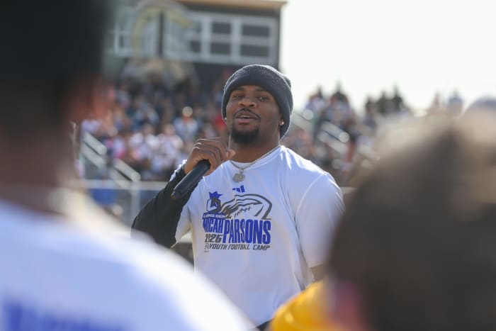 Dallas Cowboys linebacker Micah Parsons speaks to campers at the Micah Parsons Lions Den Football Camp at St. John Paul II High School in Corpus Christi, Texas, on Saturday, March 15, 2025.  