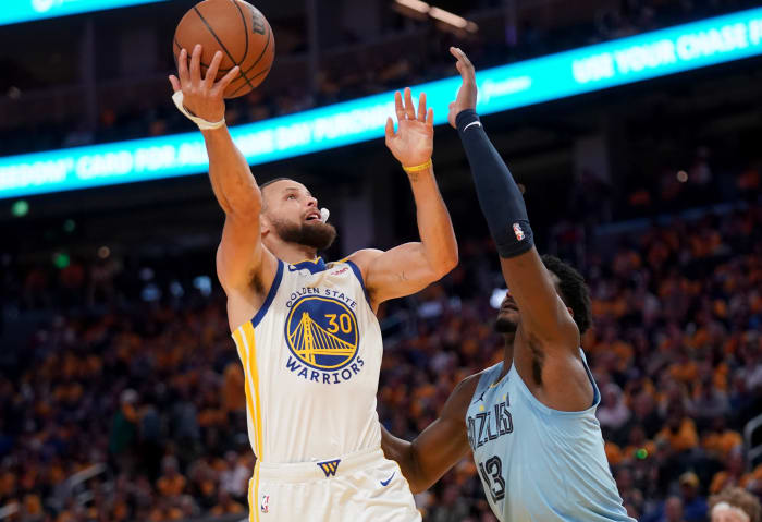 Stephen Curry shoots over Jaren Jackson Jr.