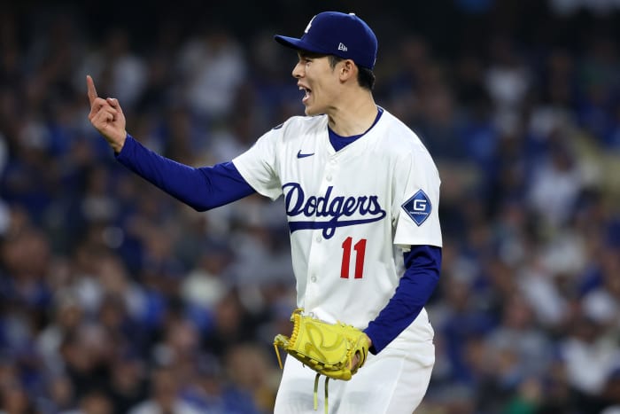 Los Angeles Dodgers pitcher Roki Sasaki (11) reacts after a pitch against the Chicago Cubs.