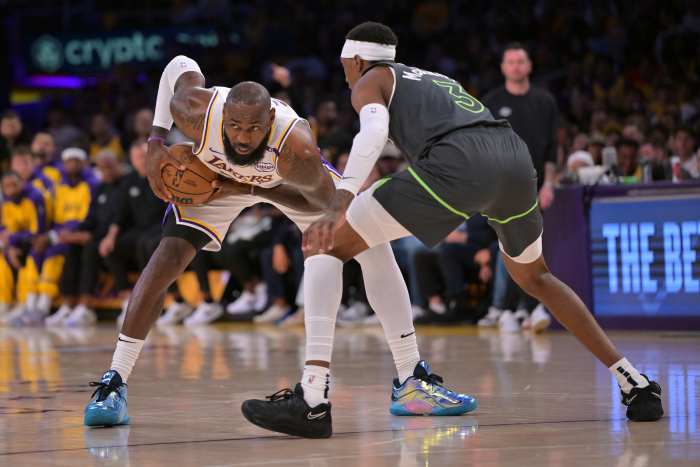 Lakers forward LeBron James defended by Timberwolves forward Jaden McDaniels.