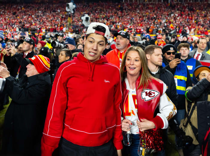  Jackson Mahomes (left) with mother Randi Mahomes on the field following the AFC Championship game against the Buffalo Bills at GEHA Field at Arrowhead Stadium.