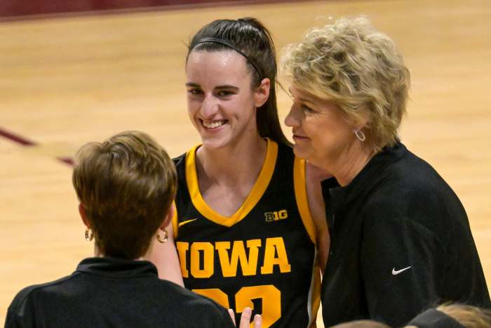 Iowa Hawkeyes guard Caitlin Clark (22) shares a moment with head coach Lisa Bluder and associate head coach Jan Jensen in 2024.