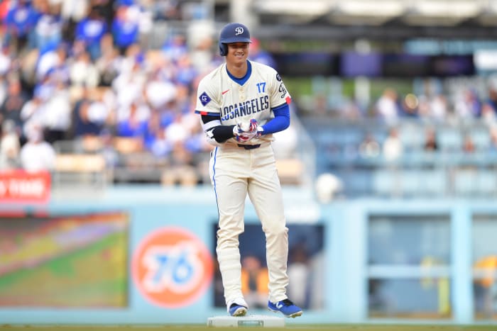 Los Angeles Dodgers two-way player Shohei Ohtani (17) reacts at second base in the first inning against the Pittsburgh Pirates at Dodger Stadium.