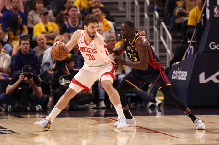 Golden State Warriors forward Draymond Green guards Houston Rockets forward Alperen Sengun