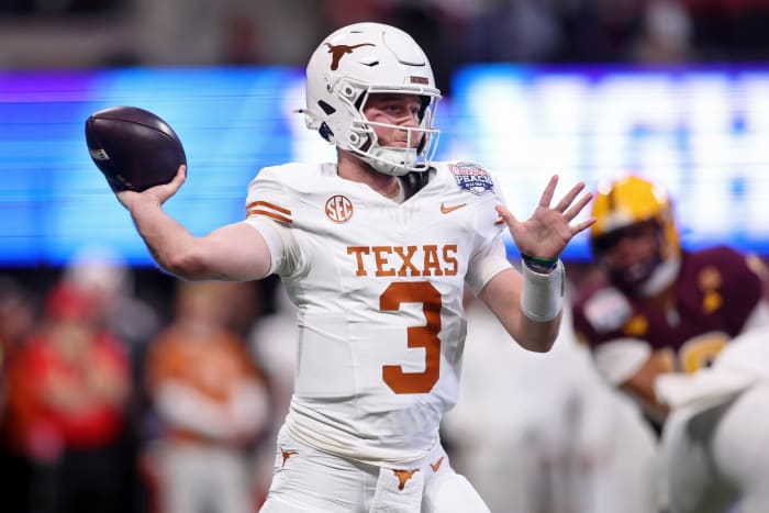 Texas Longhorns quarterback Quinn Ewers (3) passes the ball against the Arizona State Sun Devils during the first half of the Peach Bowl at Mercedes-Benz Stadium.