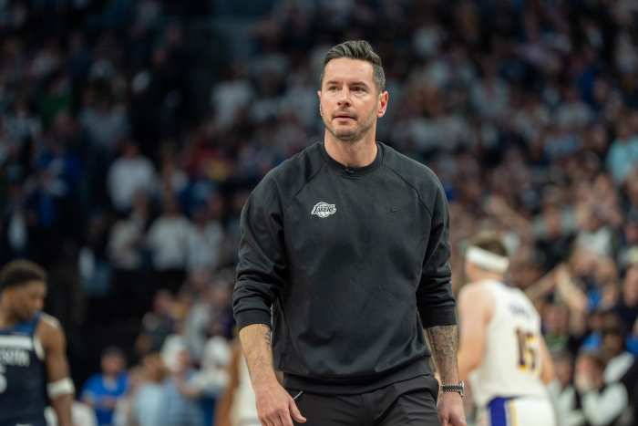 Los Angeles Lakers head coach JJ Redick reacts during a game against the Minnesota Timberwolves at Target Center.