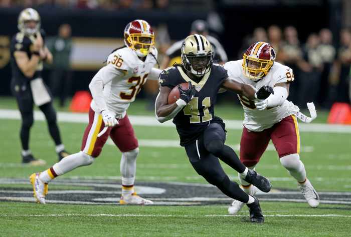Nov 19, 2017; New Orleans Saints running back Alvin Kamara (41) runs through the Washington Redskins defense. Mandatory Credit: Chuck Cook-Imagn Images