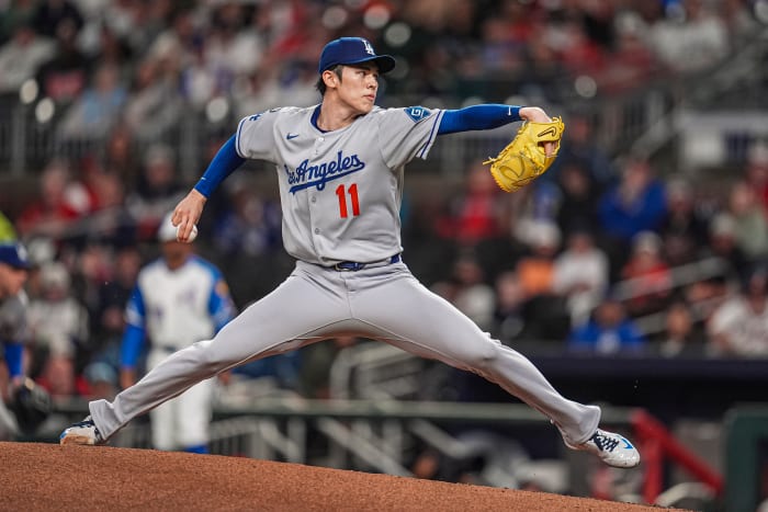 Los Angeles Dodgers starting pitcher Roki Sasaki (11) pitches against the Atlanta Braves during the first inning at Truist Park.