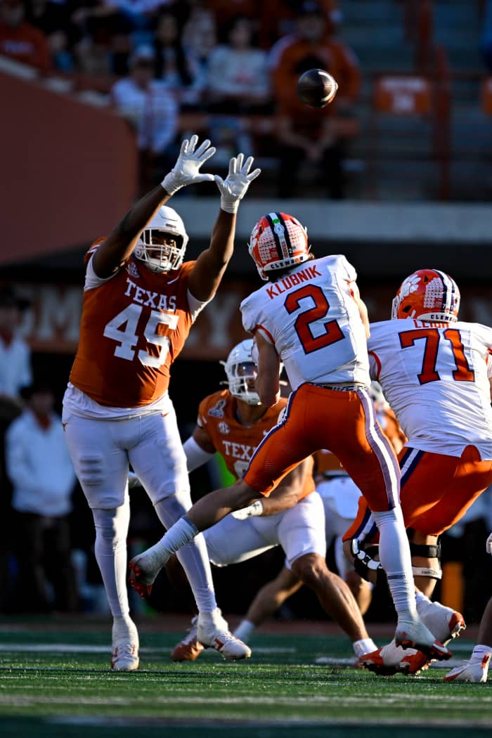 Clemson Tigers quarterback Cade Klubnik (2) is pressured by Texas Longhorns defensive lineman Vernon Broughton (45). Mandatory Credit: Jerome Miron-Imagn Images