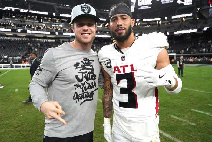 Atlanta Falcons safety Jessie Bates III takes a picture after a game against the Las Vegas Raiders. Kirby Lee-Imagn Images