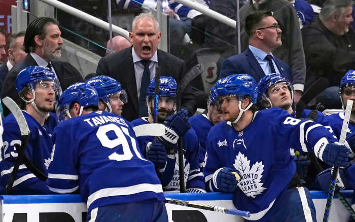 Toronto Maple Leafs head coach Craig Berube (center) talks to his players after a Florida Panthers goal during the third period of Game 1 of the second round of the 2025 Stanley Cup Playoffs at Scotiabank Arena.