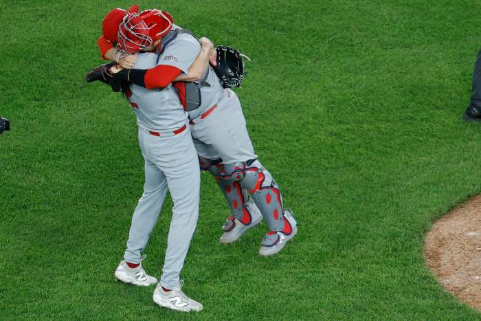 Cardinals pitcher Erick Fedde (12) celebrates with catcher Pedro Pagés (43) after throwing a complete game shutout.