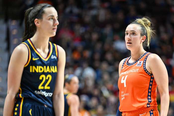 Connecticut Sun guard Marina Mabrey (4) and Indiana Fever guard Caitlin Clark (22).