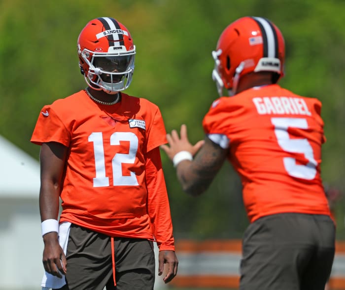 Cleveland Browns quarterback Shedeur Sanders (12) and quarterback Dillon Gabriel (5)