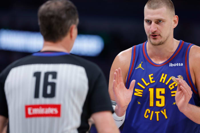 Nikola Jokic of the Nuggets talks to an official.