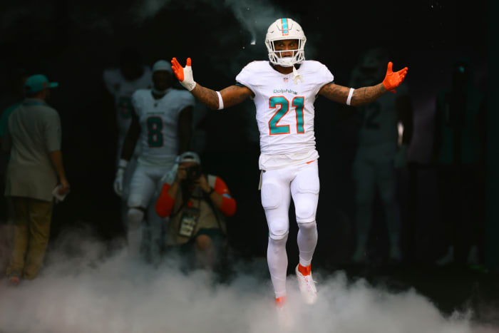 Miami Dolphins safety Jordan Poyer (21) runs onto the field before the game against the Jacksonville Jaguars at Hard Rock Stadium.
