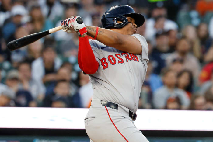 Boston Red Sox third baseman Rafael Devers (11) hits an RBI single in the seventh inning against the Detroit Tigers at Comerica Park.