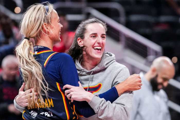Indiana Fever Sophie Cunningham (8) hugs Indiana Fever Caitlin Clark (22).