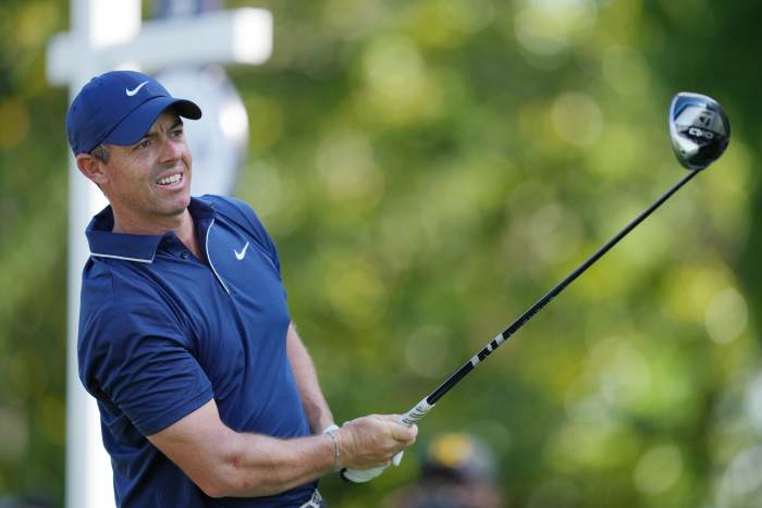 Rory McIlroy tees off on the third hole during the third round of the PGA Championship golf tournament at Quail Hollow.