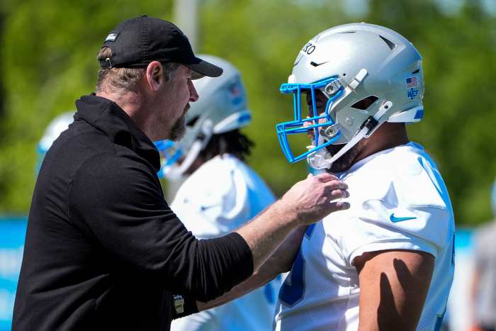 Dan Campbell and Breiden Fehoko chat at rookie mini camp.