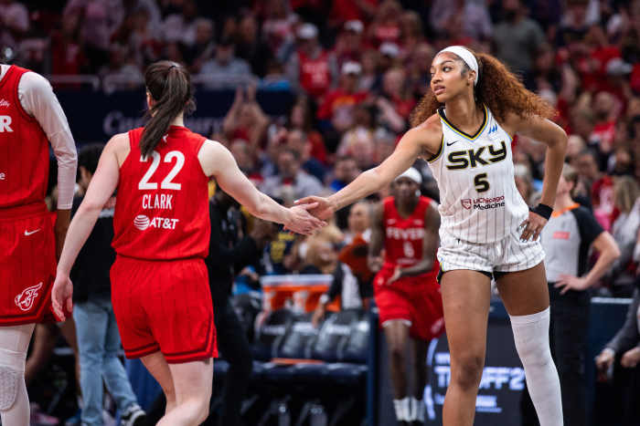Indiana Fever guard Caitlin Clark (22) and Chicago Sky forward Angel Reese (5).