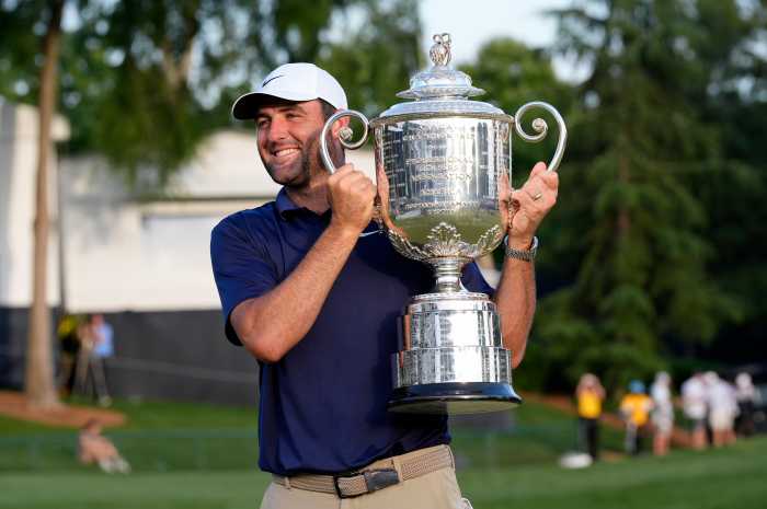 Scottie Scheffler holds the Wanamaker Trophy after winning the 2025 PGA Championship.