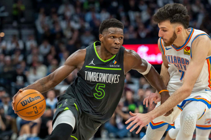 Minnesota Timberwolves guard Anthony Edwards (5) and Oklahoma City Thunder forward Chet Holmgren (7).
