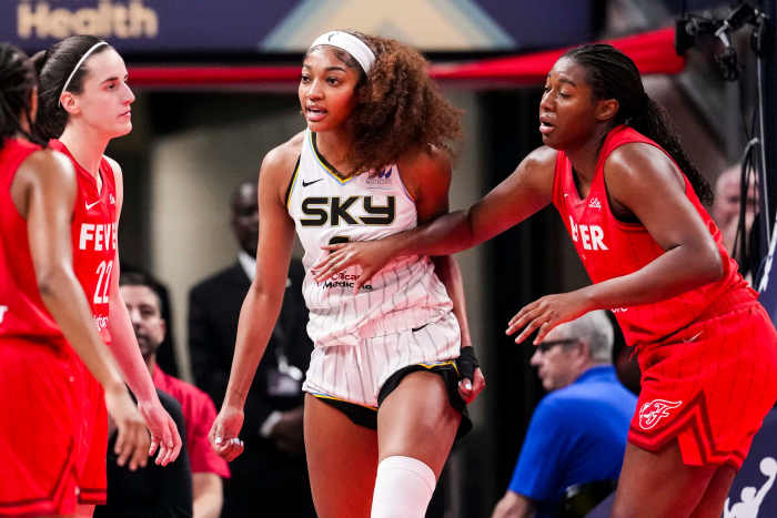 Chicago Sky forward Angel Reese (5) reacts to a flagrant foul from Indiana Fever guard Caitlin Clark (22).