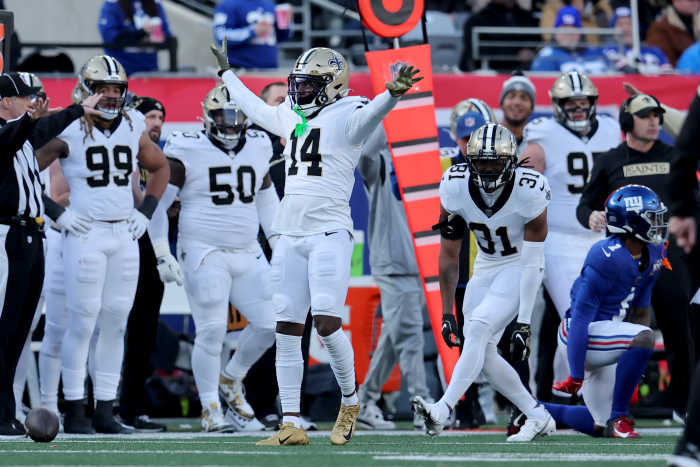 Dec 8, 2024; East Rutherford, New Jersey, USA; New Orleans Saints cornerback Kool-Aid McKinstry (14) reacts after breaking up a pass intended for New York Giants wide receiver Malik Nabers (1) during the second quarter at MetLife Stadium. Mandatory Credit: Brad Penner-Imagn Images